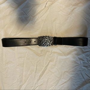 Black leather belt with silver buckle.